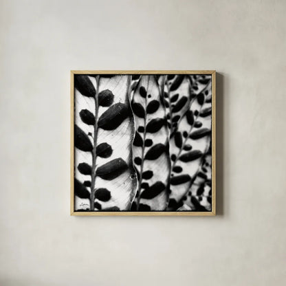 Leaves and Vines by Aledanda. Shown in a natural wood glass frame for a timeless modern aesthetic. Available as an archival giclee rolled canvas, fine art paper, or poster print. SKU 37455a.