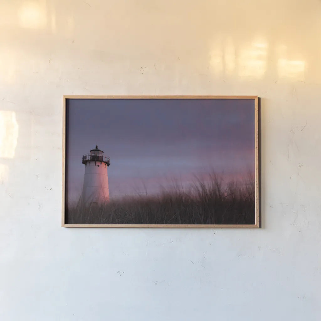Lighthouse at Sunset Crop by Aledanda. shown as a paper print in a natural frame. Available as a archival giclee rolled canvas, fine art paper, or poster print. SKU 46207i.