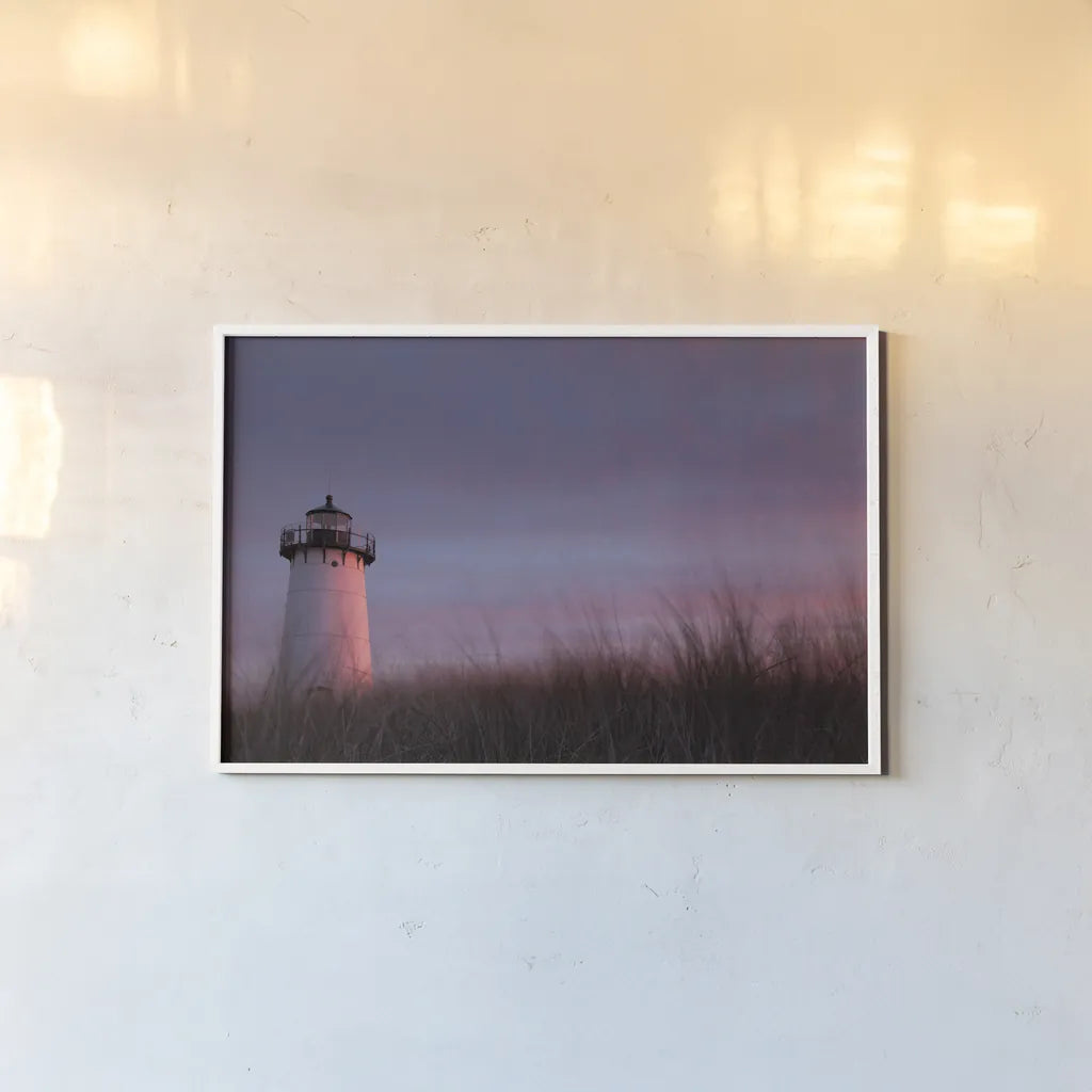 Lighthouse at Sunset Crop by Aledanda. shown as a paper print in a white frame. Available as a archival giclee rolled canvas, fine art paper, or poster print. SKU 46207i.