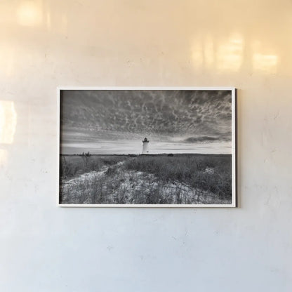 Lighthouse on Coast by Aledanda. shown as a paper print in a white frame. Available as a archival giclee rolled canvas, fine art paper, or poster print. SKU 37448i.