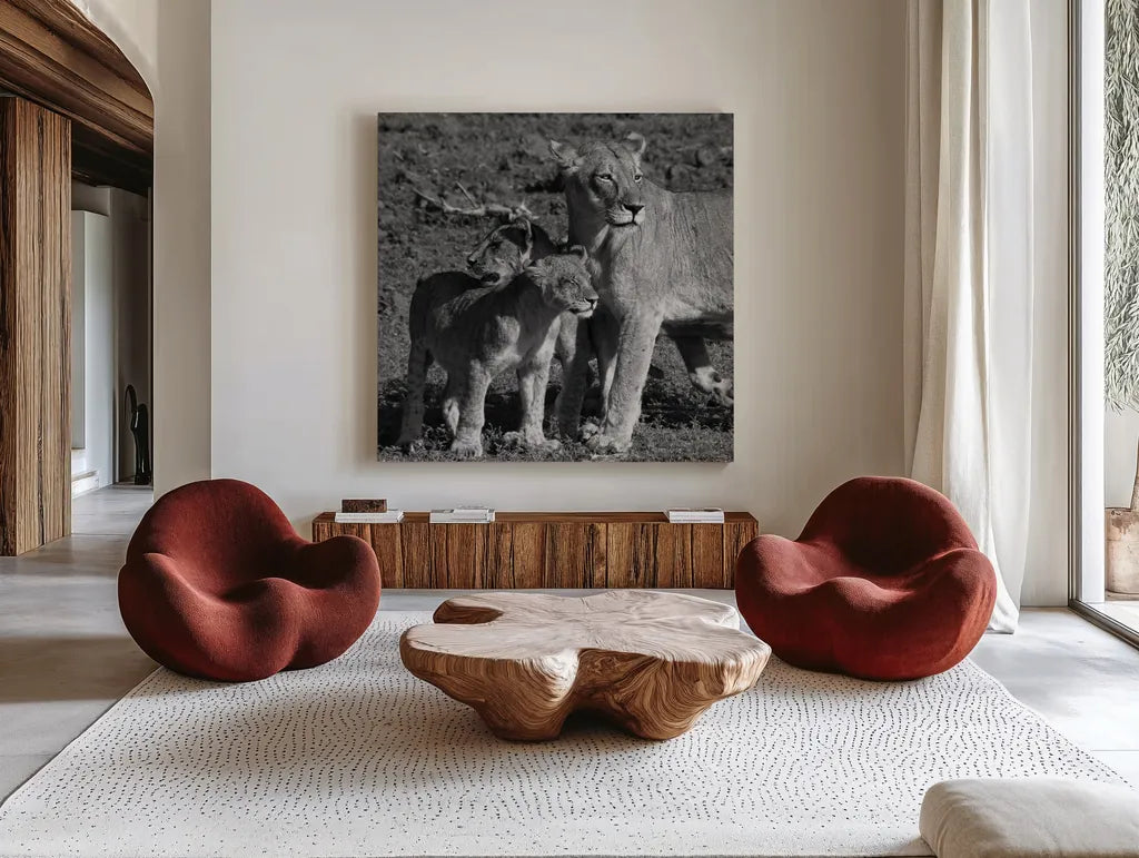 Lioness and Cubs by Aledanda. Shown as extra-large giant wall art in a modern living room. Available as an archival giclee rolled canvas, fine art paper, or poster print. SKU 58138a.