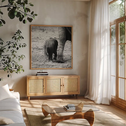 Mama and Baby Elephant II by Aledanda. Shown in a natural wood frame in a cozy modern living room. Available as an archival giclee rolled canvas, fine art paper, or poster print. SKU 58136a.