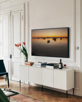 Marthas Vineyard Sunset II by Aledanda. shown as a framed stretched canvas in a living room above a console. Available as a archival giclee rolled canvas, fine art paper, or poster print. SKU 53596i.