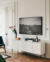 Nantucket Light by Aledanda. shown as a framed stretched canvas in a living room above a console. Available as a archival giclee rolled canvas, fine art paper, or poster print. SKU 64374i.