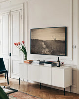 Nantucket Light Sepia by Aledanda. shown as a framed stretched canvas in a living room above a console. Available as a archival giclee rolled canvas, fine art paper, or poster print. SKU 79232i.