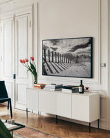 Nantucket Shadows by Aledanda. shown as a framed stretched canvas in a living room above a console. Available as a archival giclee rolled canvas, fine art paper, or poster print. SKU 64376i.