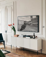 Piazza BW by Aledanda. shown as a framed stretched canvas in a living room above a console. Available as a archival giclee rolled canvas, fine art paper, or poster print. SKU 98037i.