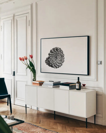 Pinecone on White by Aledanda. shown as a framed stretched canvas in a living room above a console. Available as a archival giclee rolled canvas, fine art paper, or poster print. SKU 57579i.