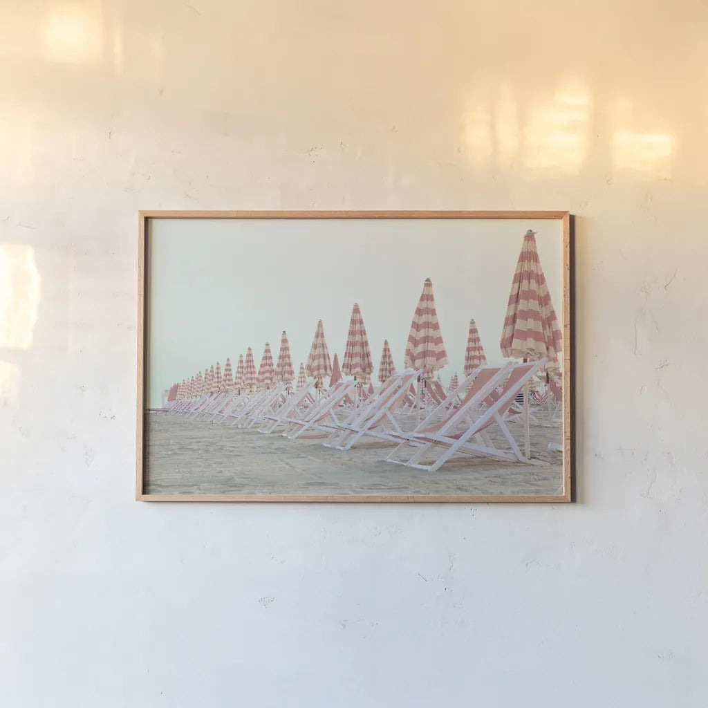 Pink Umbrellas by Aledanda. shown as a paper print in a natural frame. Available as a archival giclee rolled canvas, fine art paper, or poster print. SKU 82460i.