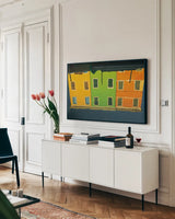 Reflections of Burano IX by Aledanda. shown as a framed stretched canvas in a living room above a console. Available as a archival giclee rolled canvas, fine art paper, or poster print. SKU 41602i.