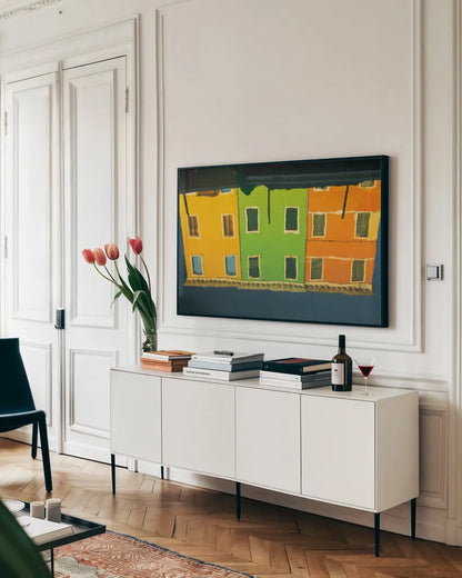 Reflections of Burano IX by Aledanda. shown as a framed stretched canvas in a living room above a console. Available as a archival giclee rolled canvas, fine art paper, or poster print. SKU 41602i.