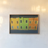 Reflections of Burano IX by Aledanda. shown as a paper print in a natural frame. Available as a archival giclee rolled canvas, fine art paper, or poster print. SKU 41602i.