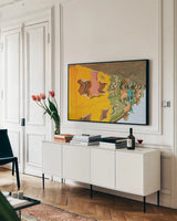 Reflections of Burano VI by Aledanda. shown as a framed stretched canvas in a living room above a console. Available as a archival giclee rolled canvas, fine art paper, or poster print. SKU 41599i.