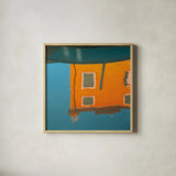 Reflections of Burano VII by Aledanda. Shown in a natural wood glass frame for a timeless modern aesthetic. Available as an archival giclee rolled canvas, fine art paper, or poster print. SKU 41600a.