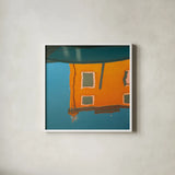 Reflections of Burano VII by Aledanda. Shown in a crisp white glass frame for a clean and minimalist style. Available as an archival giclee rolled canvas, fine art paper, or poster print. SKU 41600a.