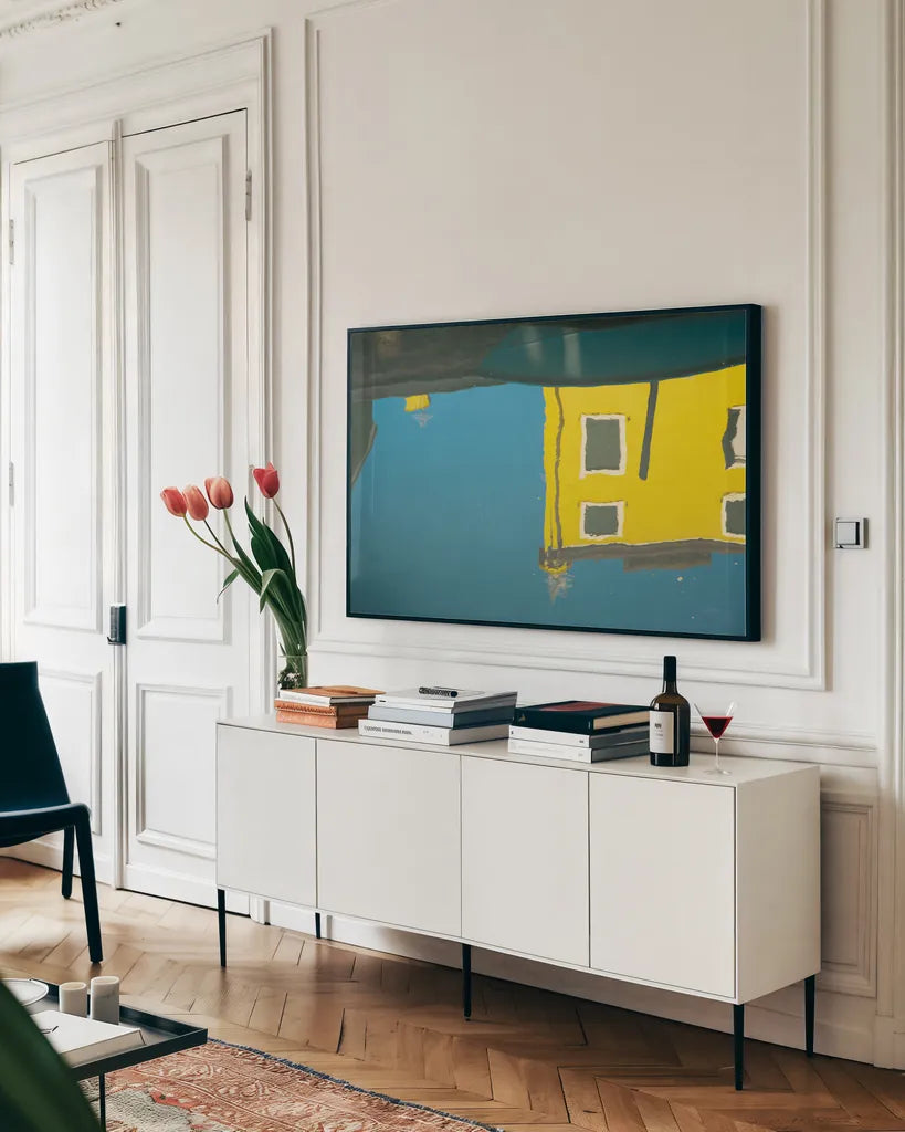 Reflections of Burano VIII by Aledanda. shown as a framed stretched canvas in a living room above a console. Available as a archival giclee rolled canvas, fine art paper, or poster print. SKU 41601i.