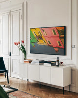 Reflections of Burano X by Aledanda. shown as a framed stretched canvas in a living room above a console. Available as a archival giclee rolled canvas, fine art paper, or poster print. SKU 41603i.