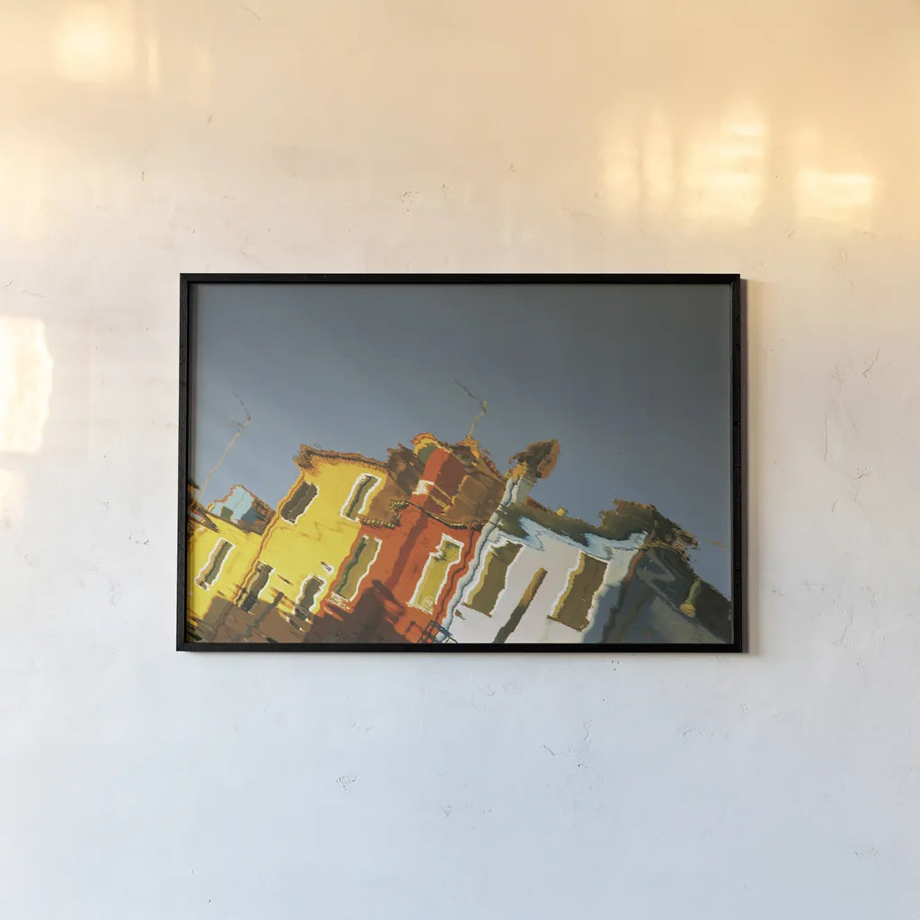 Reflections of Burano XI by Aledanda. shown as a paper print in a black flame. Available as a archival giclee rolled canvas, fine art paper, or poster print. SKU 41604i.