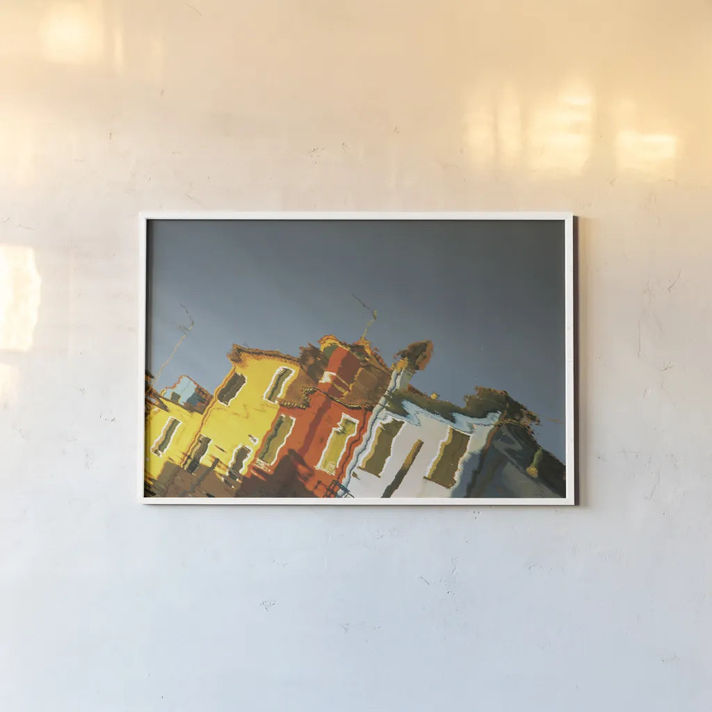 Reflections of Burano XI by Aledanda. shown as a paper print in a white frame. Available as a archival giclee rolled canvas, fine art paper, or poster print. SKU 41604i.