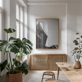 Skyscraper I by Aledanda. shown as a print in a natural wood frame in a dining room. Available as a archival giclee rolled canvas, fine art paper, or poster print. SKU 53641h.