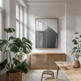 Skyscraper II BW Flipped by Aledanda. shown as a print in a natural wood frame in a dining room. Available as a archival giclee rolled canvas, fine art paper, or poster print. SKU 57208h.