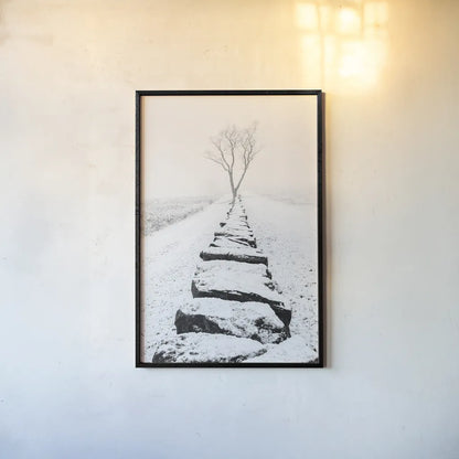 Snowy Stone Wall by Aledanda. shown as a paper print in a black flame. Available as a archival giclee rolled canvas, fine art paper, or poster print. SKU 64380h.