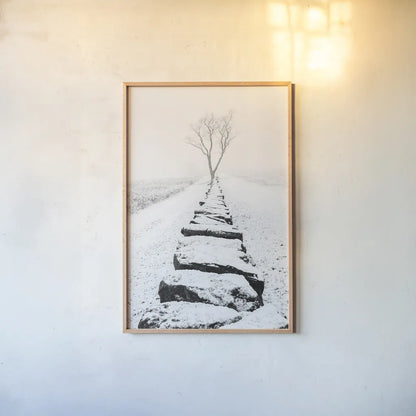 Snowy Stone Wall by Aledanda. shown as a paper print in a natural frame. Available as a archival giclee rolled canvas, fine art paper, or poster print. SKU 64380h.