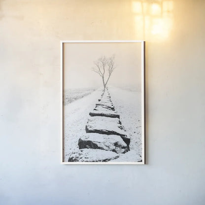 Snowy Stone Wall by Aledanda. shown as a paper print in a white frame. Available as a archival giclee rolled canvas, fine art paper, or poster print. SKU 64380h.