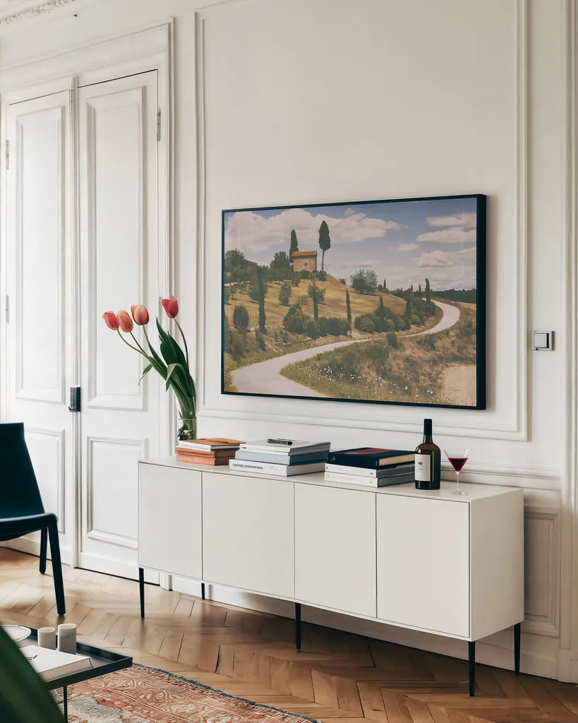 Strada Bianca I by Aledanda. shown as a framed stretched canvas in a living room above a console. Available as a archival giclee rolled canvas, fine art paper, or poster print. SKU 47847i.