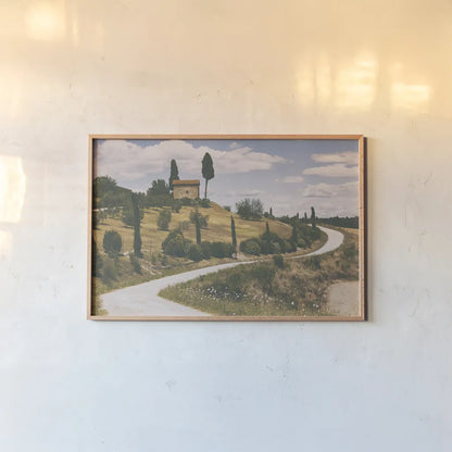 Strada Bianca I by Aledanda. shown as a paper print in a natural frame. Available as a archival giclee rolled canvas, fine art paper, or poster print. SKU 47847i.