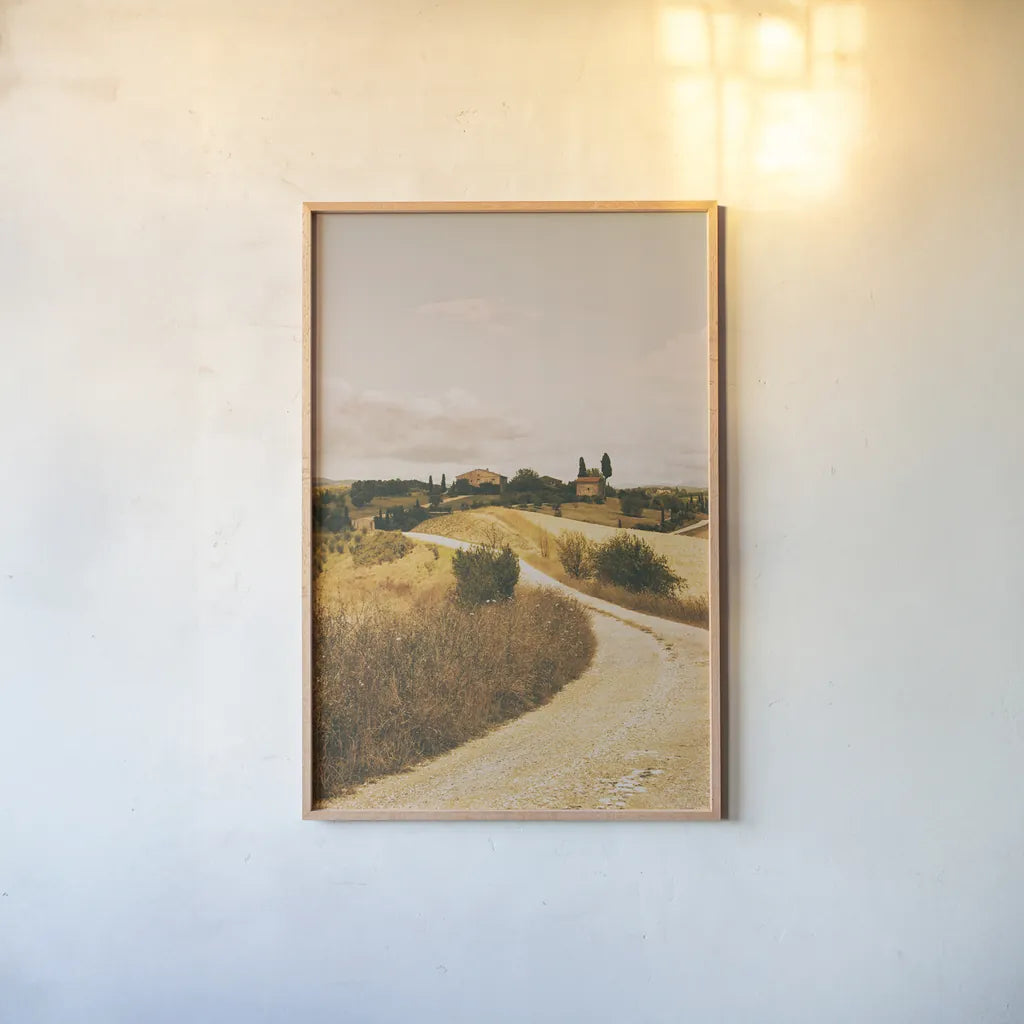 Strada Bianca II by Aledanda. shown as a paper print in a natural frame. Available as a archival giclee rolled canvas, fine art paper, or poster print. SKU 47848h.