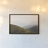 The Pass by Aledanda. shown as a paper print in a black flame. Available as a archival giclee rolled canvas, fine art paper, or poster print. SKU 63232i.
