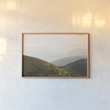 The Pass by Aledanda. shown as a paper print in a natural frame. Available as a archival giclee rolled canvas, fine art paper, or poster print. SKU 63232i.
