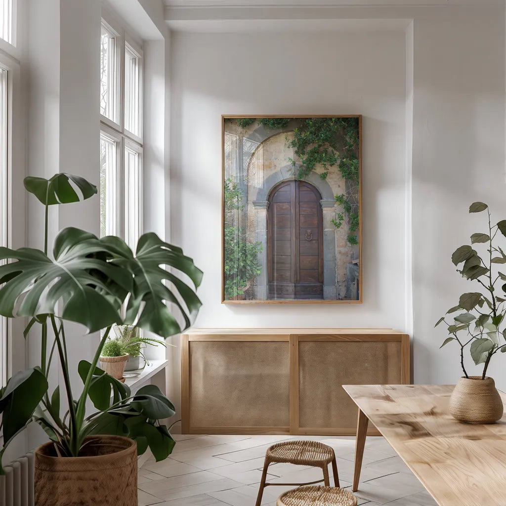 Venice Doorway by Aledanda. shown as a print in a natural wood frame in a dining room. Available as a archival giclee rolled canvas, fine art paper, or poster print. SKU 58391h.