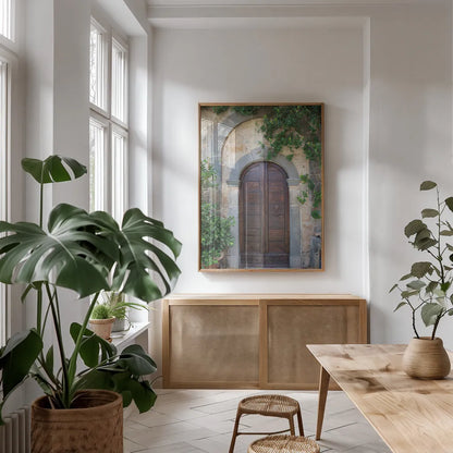 Venice Doorway by Aledanda. shown as a print in a natural wood frame in a dining room. Available as a archival giclee rolled canvas, fine art paper, or poster print. SKU 58391h.
