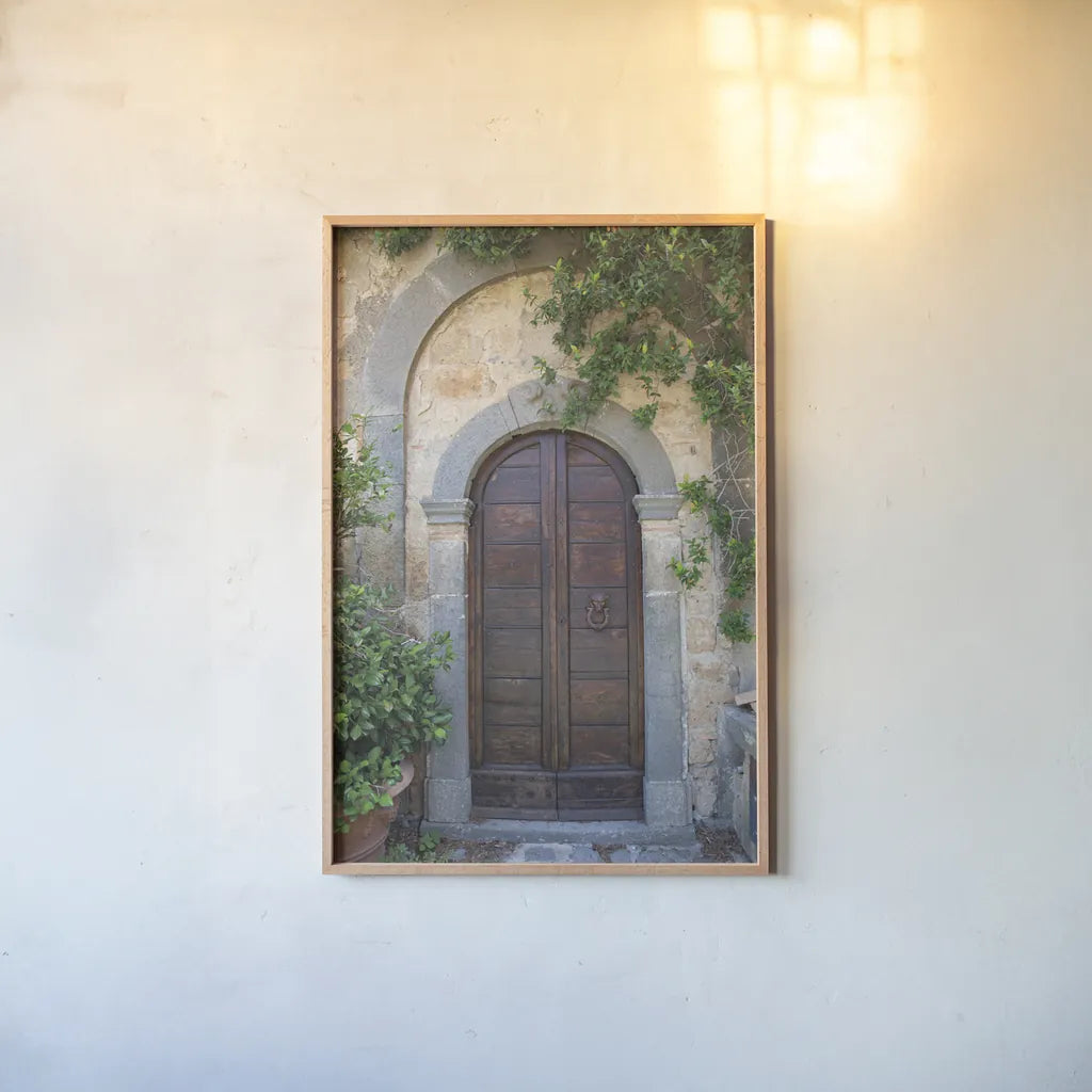 Venice Doorway by Aledanda. shown as a paper print in a natural frame. Available as a archival giclee rolled canvas, fine art paper, or poster print. SKU 58391h.