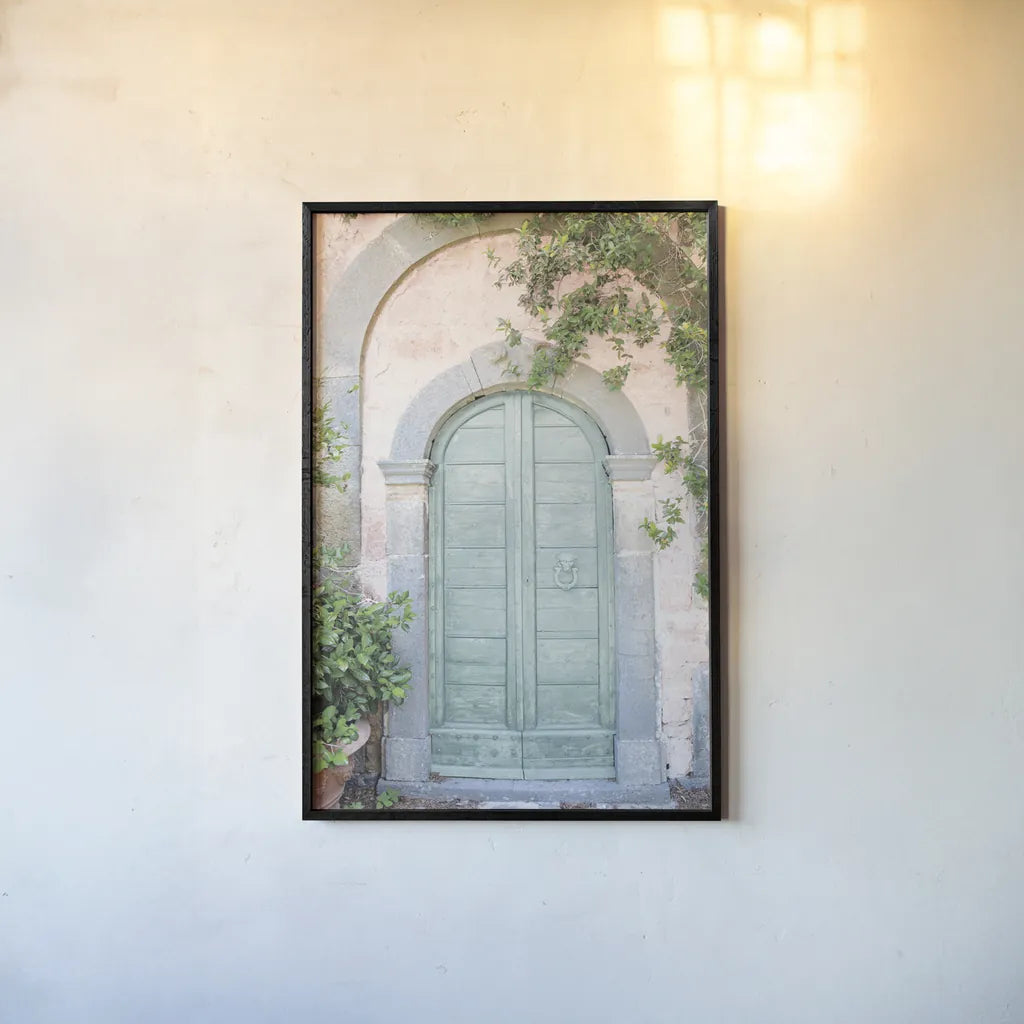 Venice Doorway Light by Aledanda. shown as a paper print in a black flame. Available as a archival giclee rolled canvas, fine art paper, or poster print. SKU 67213h.