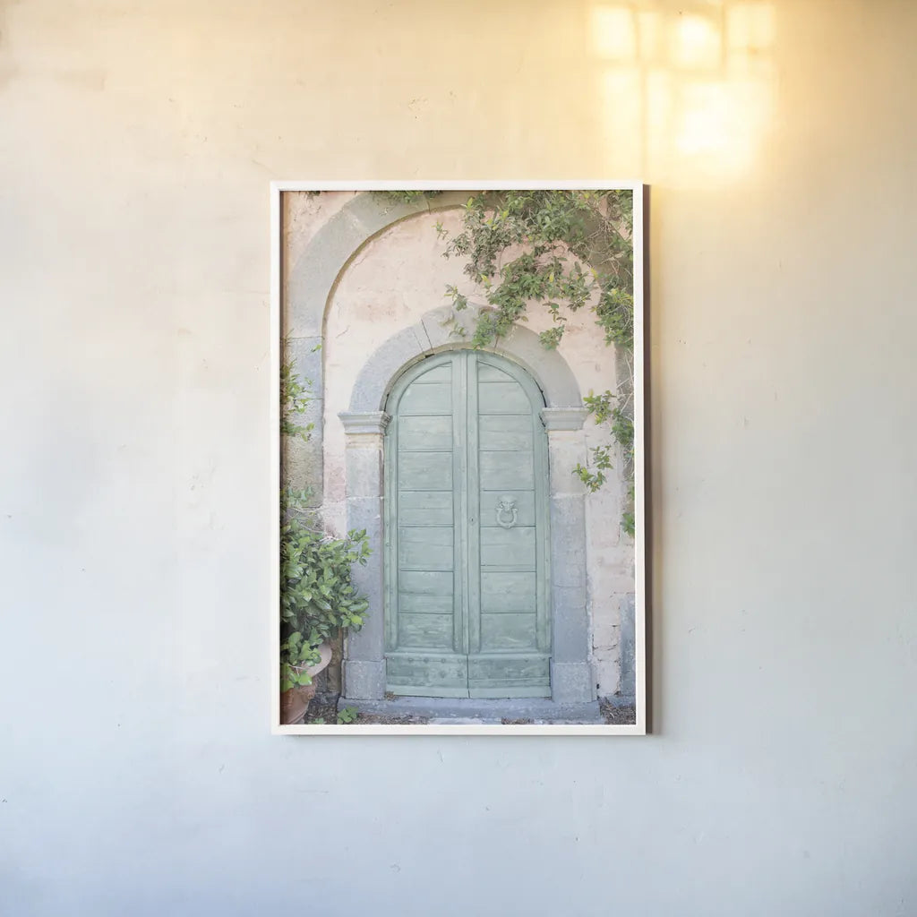 Venice Doorway Light by Aledanda. shown as a paper print in a white frame. Available as a archival giclee rolled canvas, fine art paper, or poster print. SKU 67213h.