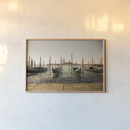 Venice Gondolas by Aledanda. shown as a paper print in a natural frame. Available as a archival giclee rolled canvas, fine art paper, or poster print. SKU 81701i.