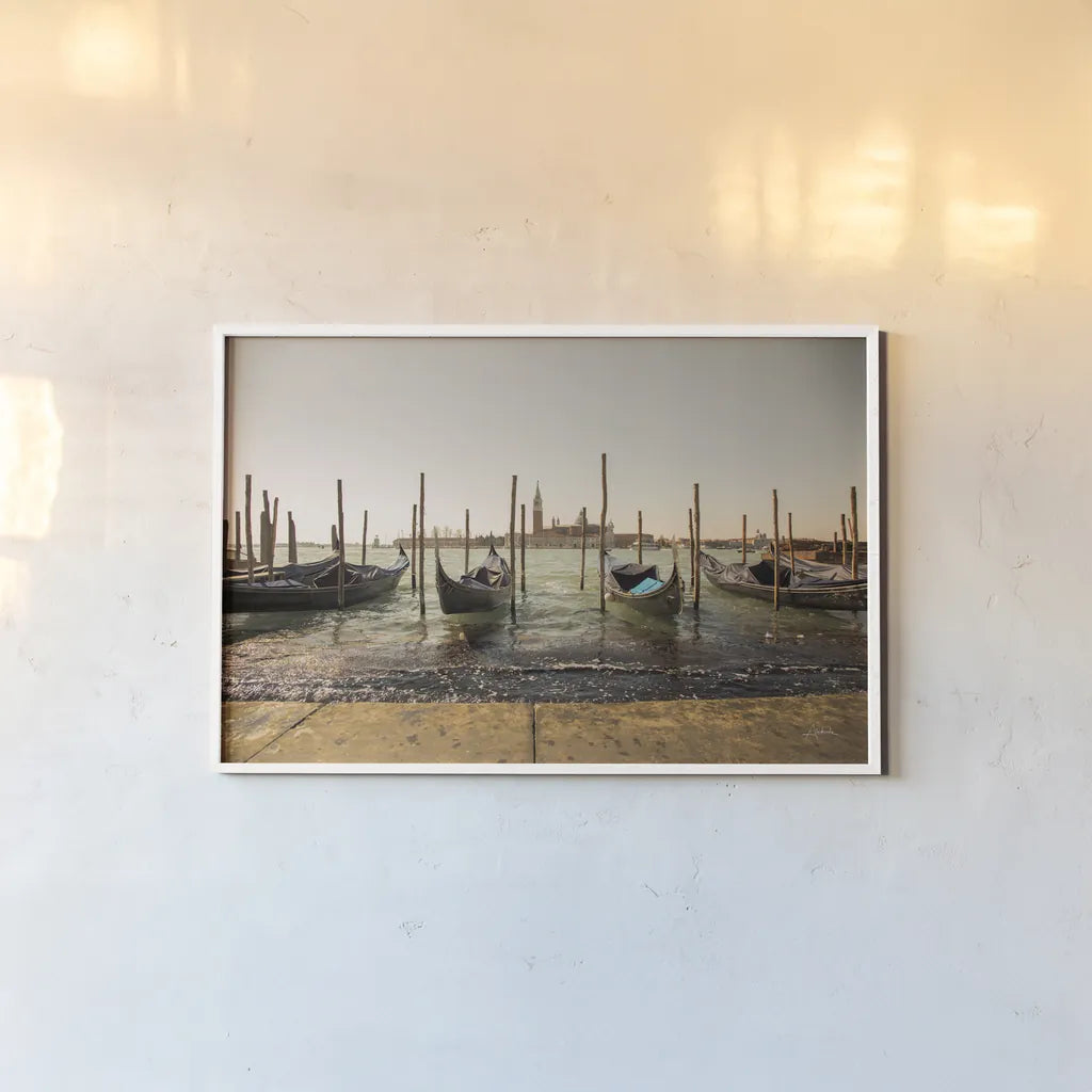 Venice Gondolas by Aledanda. shown as a paper print in a white frame. Available as a archival giclee rolled canvas, fine art paper, or poster print. SKU 81701i.