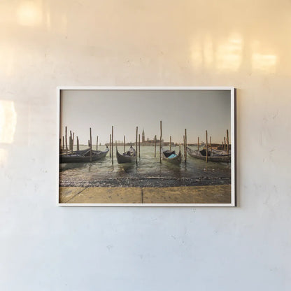 Venice Gondolas by Aledanda. shown as a paper print in a white frame. Available as a archival giclee rolled canvas, fine art paper, or poster print. SKU 81701i.