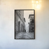 Village Square by Aledanda. shown as a paper print in a black flame. Available as a archival giclee rolled canvas, fine art paper, or poster print. SKU 67690h.