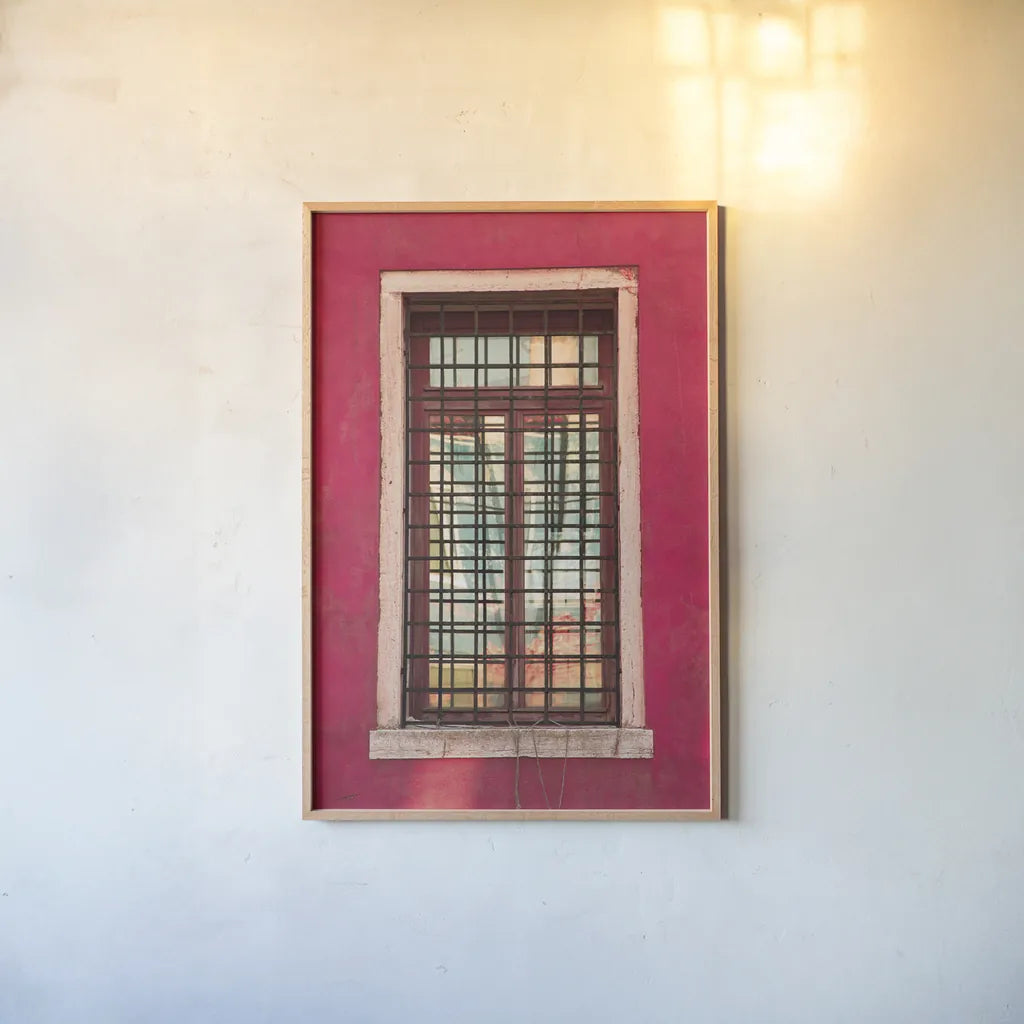 Windows of Burano III by Aledanda. shown as a paper print in a natural frame. Available as a archival giclee rolled canvas, fine art paper, or poster print. SKU 41609h.