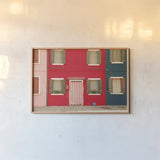Windows of Burano VI by Aledanda. shown as a paper print in a natural frame. Available as a archival giclee rolled canvas, fine art paper, or poster print. SKU 41612i.