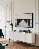 Winter Dock by Aledanda. shown as a framed stretched canvas in a living room above a console. Available as a archival giclee rolled canvas, fine art paper, or poster print. SKU 64384i.