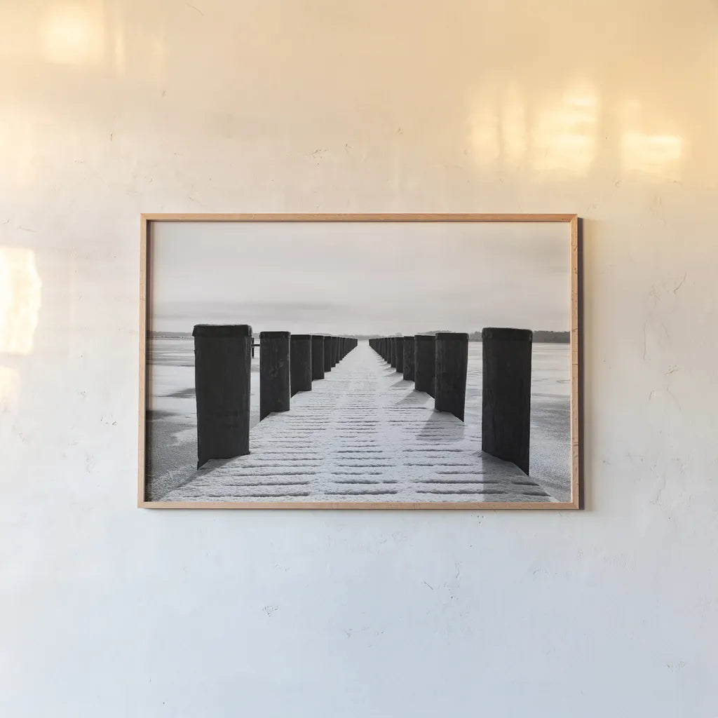 Winter Dock by Aledanda. shown as a paper print in a natural frame. Available as a archival giclee rolled canvas, fine art paper, or poster print. SKU 64384i.