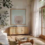 Cuddly Brown Bear by Ann Kelle. Shown in a natural wood frame in a cozy modern living room. Available as an archival giclee rolled canvas, fine art paper, or poster print. SKU 62024a.