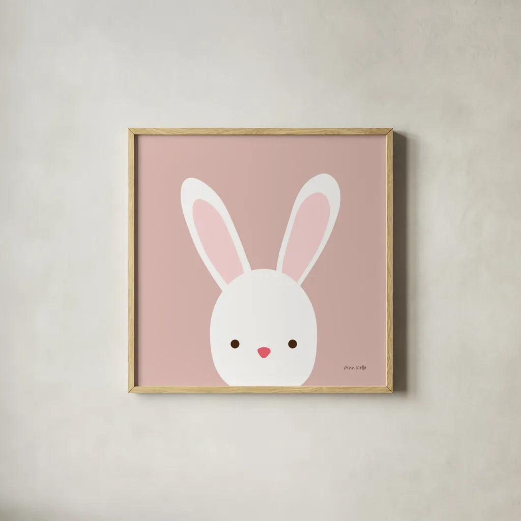 Cuddly Bunny Soft Pink by Ann Kelle. Shown in a natural wood glass frame for a timeless modern aesthetic. Available as an archival giclee rolled canvas, fine art paper, or poster print. SKU 62025a.