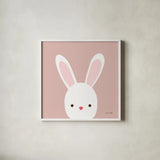 Cuddly Bunny Soft Pink by Ann Kelle. Shown in a crisp white glass frame for a clean and minimalist style. Available as an archival giclee rolled canvas, fine art paper, or poster print. SKU 62025a.