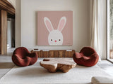 Cuddly Bunny Soft Pink by Ann Kelle. Shown as extra-large giant wall art in a modern living room. Available as an archival giclee rolled canvas, fine art paper, or poster print. SKU 62025a.